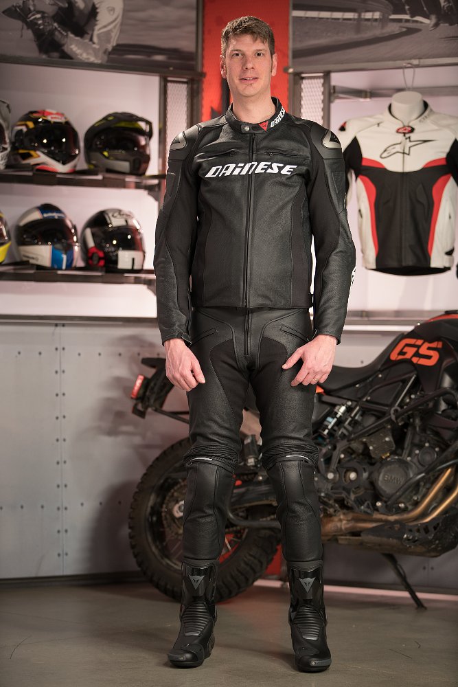 Model wearing Dainese Racing D1 Jacket and Dainese Alien Pants
