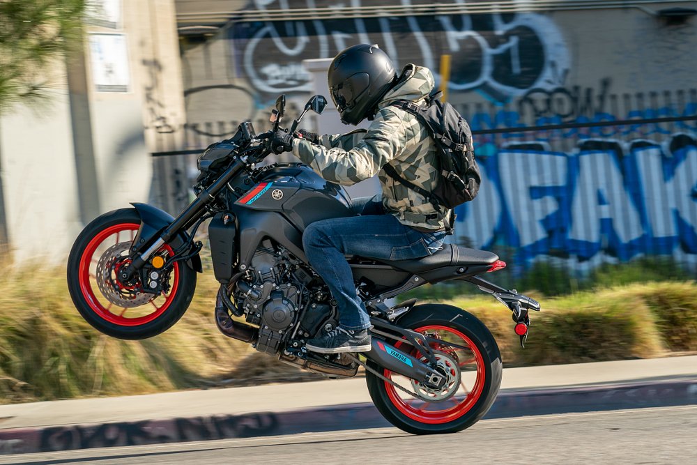 2021 Yamaha MT-09 wheelie on city street