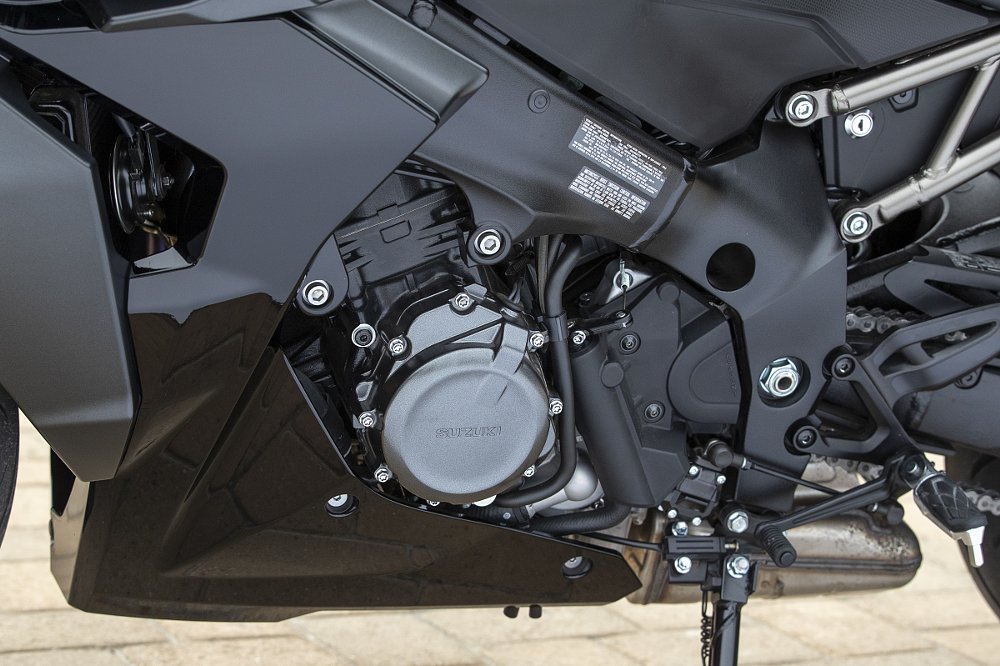 closeup shot of side of engine with footpeg and shift lever