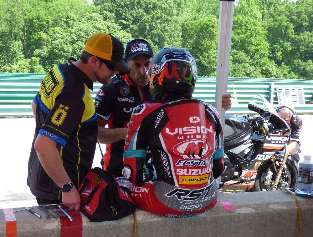 Sam Lochoff talks with his crew chief in a break during qualifying