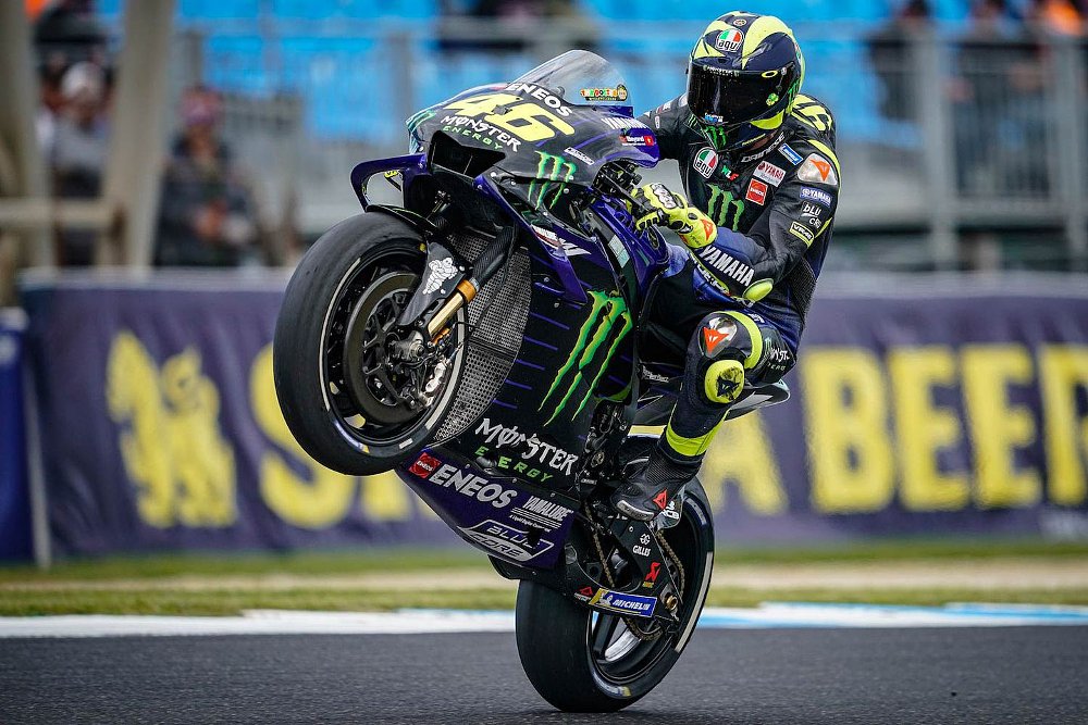Valentino Rossi does a celebratory wheelie.