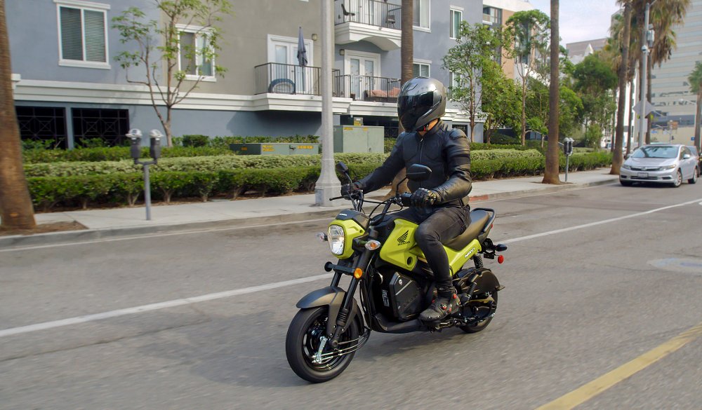 rider on a Honda Navi in the city