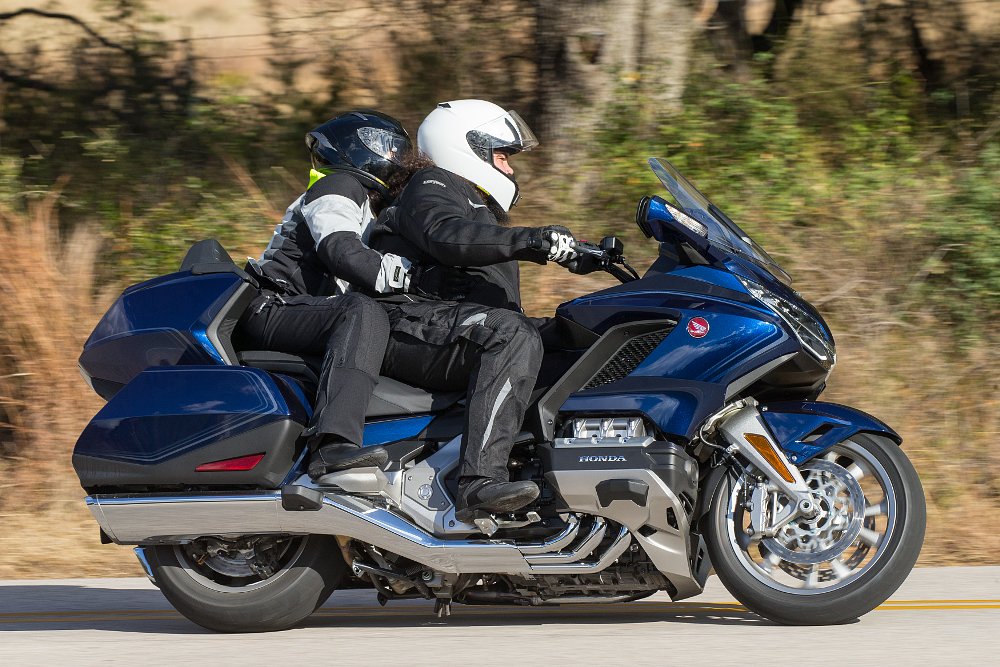 rider and passenger on a Honda Gold Wing on the road