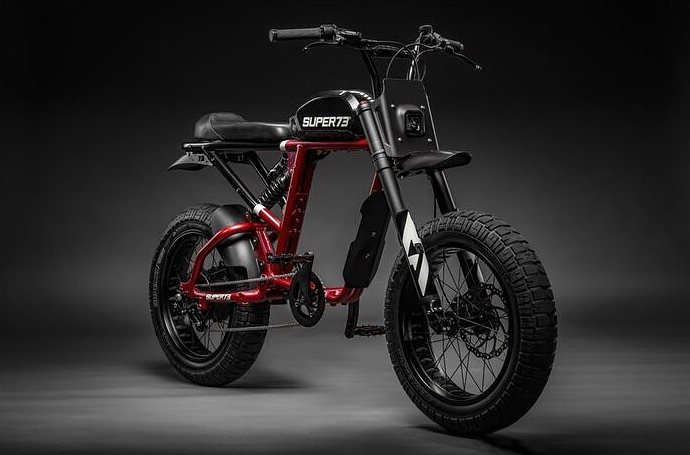 A front view of the Super73 RX which has bike pedals but can go at road worthy speeds in color red