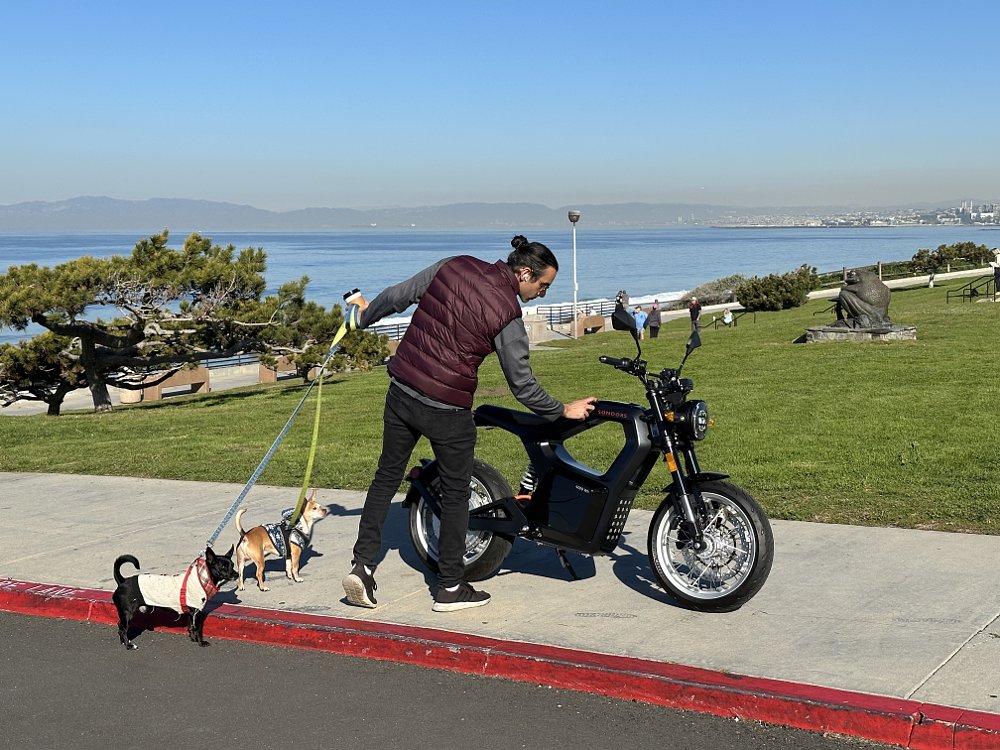 Sondors MetaCycle in Redondo Beach, CA, with a person looking closely at the bike.