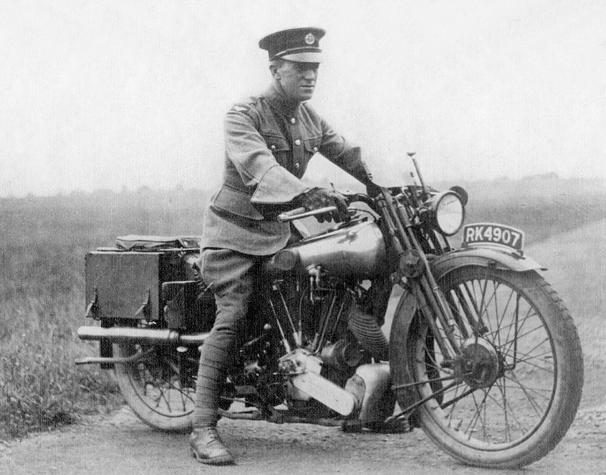 a black and white photo of the famous T.E. Lawrence on his motorcycle