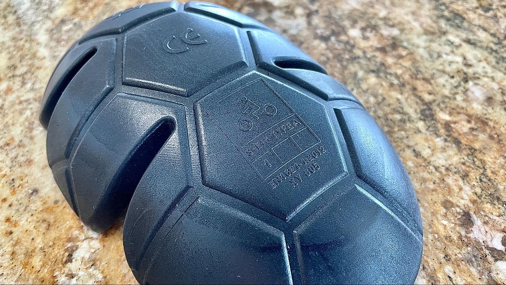 A photo of a CE rated impact armor and its label