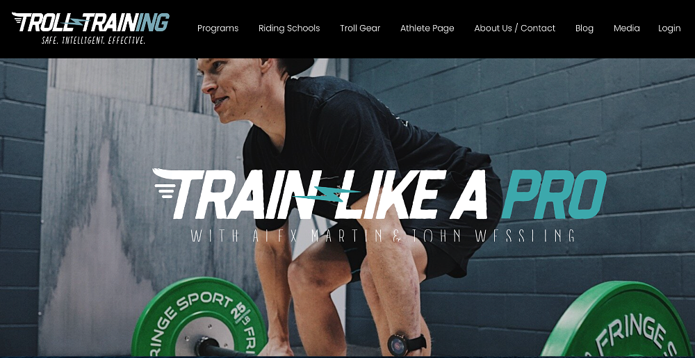 Alex Martin lifting weights in a gym