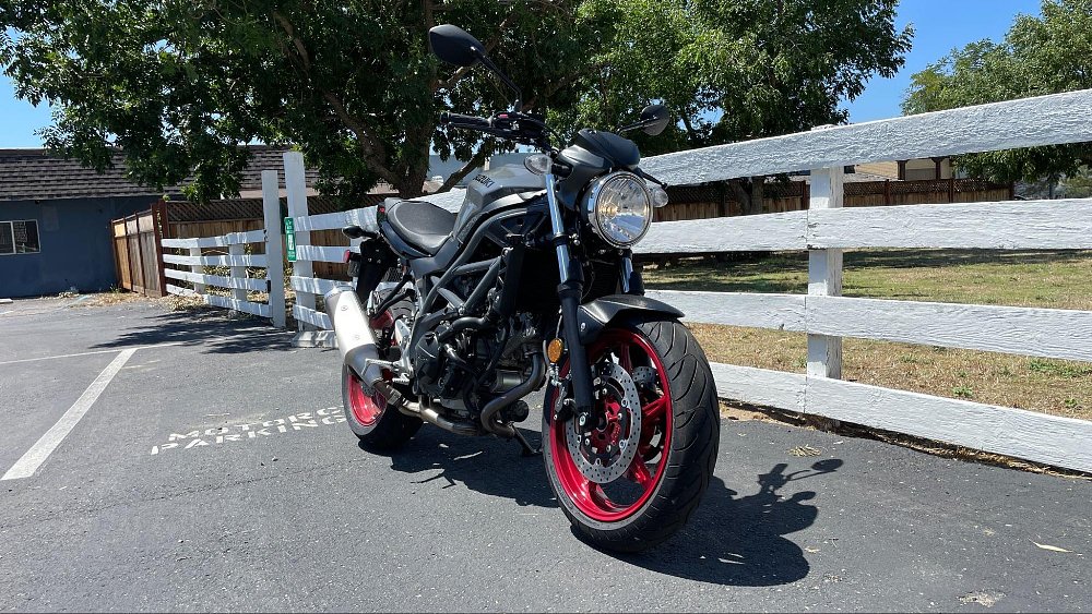the sv650 three quarter front view in a sunny parking lot