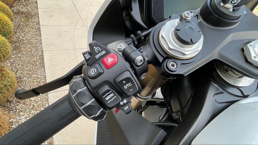 a close up view of the left hand button cluster on the bmw s 1000 rr handlebars