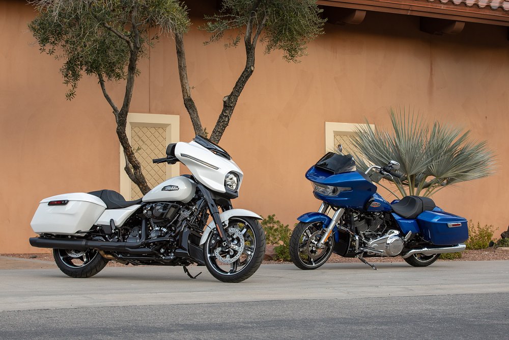new Road Glide and Street Glide parked in front of a hotel