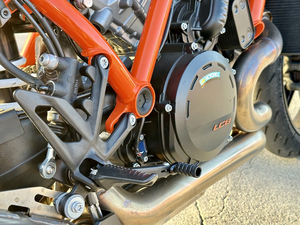 Detail image of the footpeg mount on a KTM 1390 Super Duke R.
