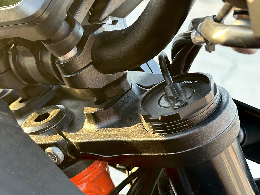 Detail image of the fork top and top triple clamp on a KTM 1390 Super Duke R.
