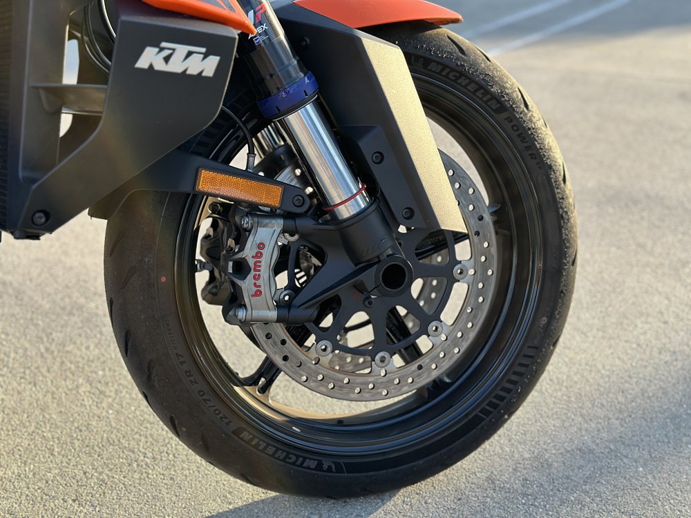 Detail image of the front brake on a KTM 1390 Super Duke R.
