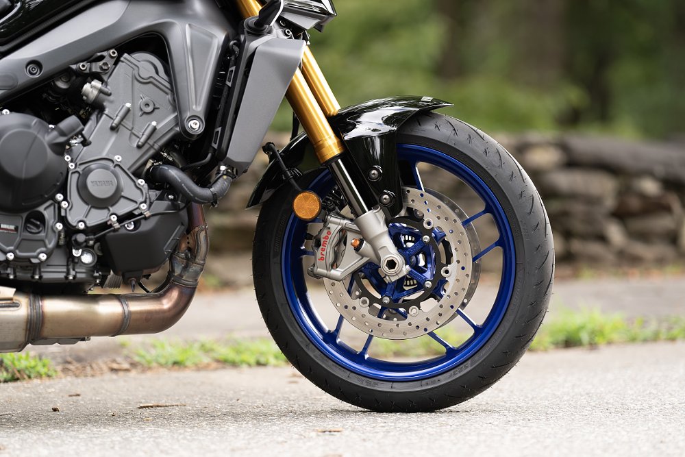 close shot of front wheel, brakes, and suspension on the MT-09 SP