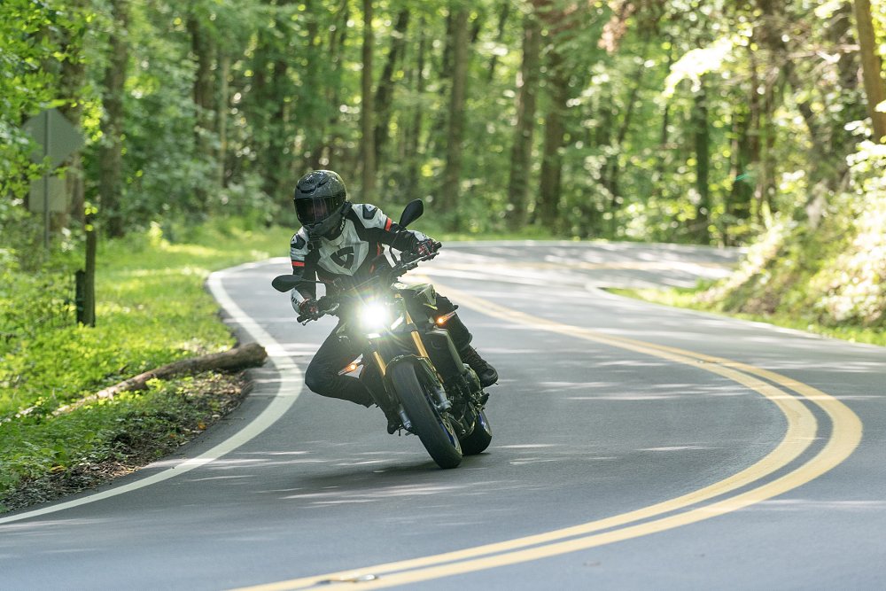 riding the MT-09 SP through curves through the woods