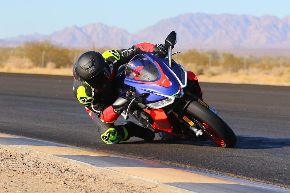 Ari Henning riding the RS 660 on a track in the desert