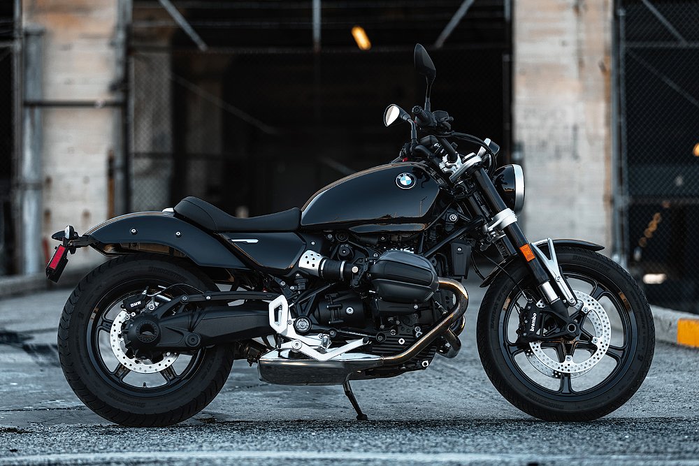 The cruiser-styled R 12 stands at bottom of a shipping dock.