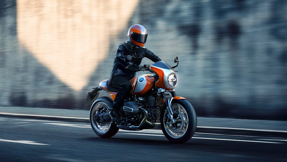 A male rider pilots the R 12 S down an urban street.