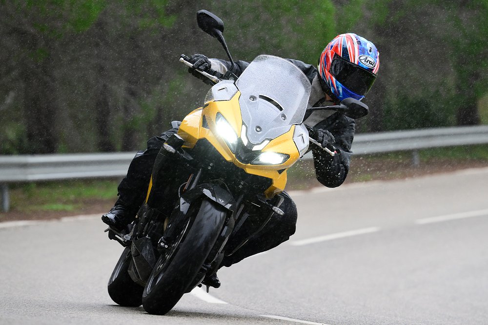 Dustin riding the Tiger Sport 800 through the rain.