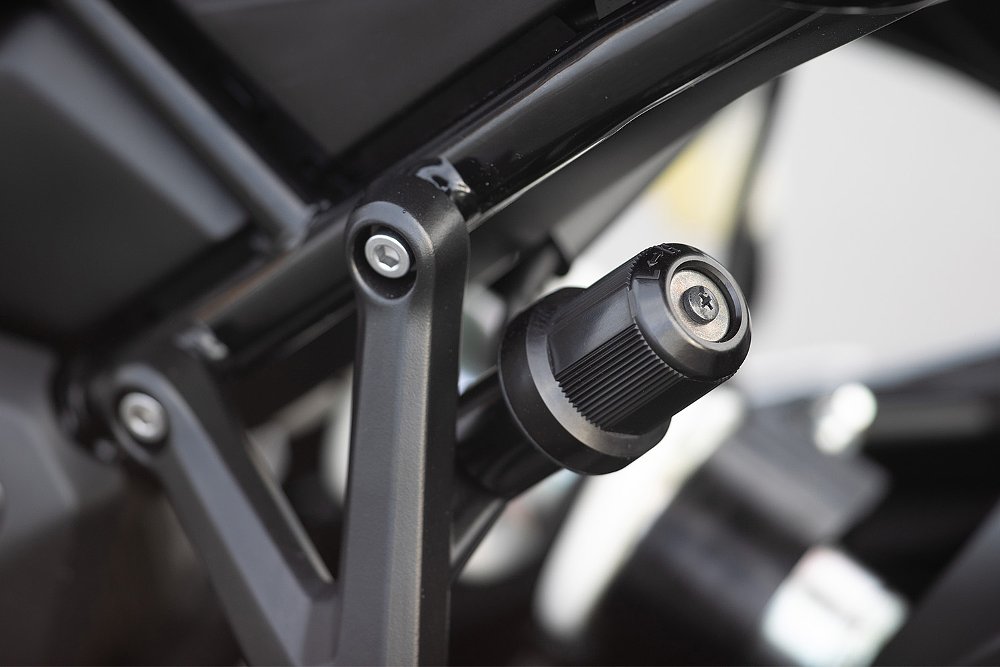 A close-up of the Tiger Sport 800's rear shock preload adjuster.