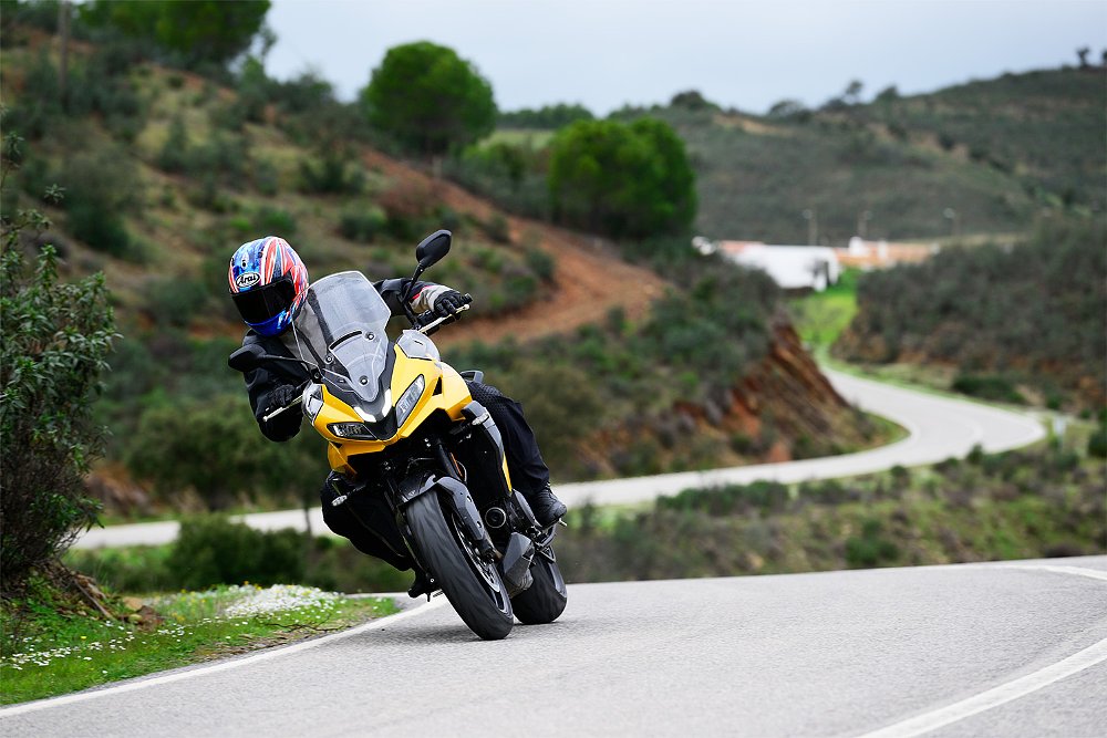 Dustin rides the Tiger Sport 800 through a set of corners along the Portuguese countryside.