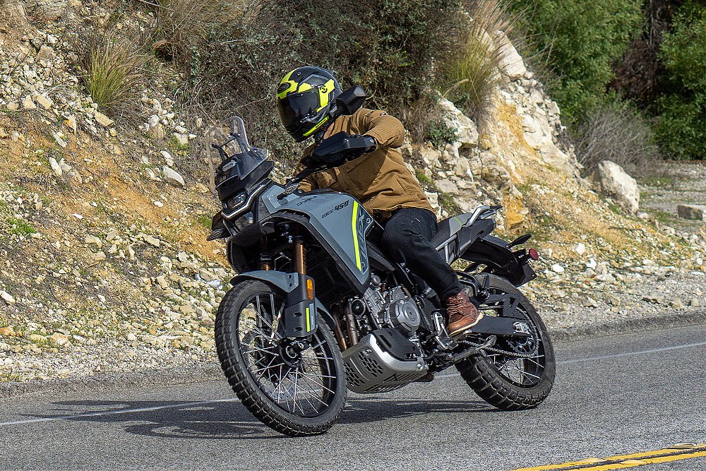 Dustin rides the CFMOTO Ibex 450 along a canyon road.