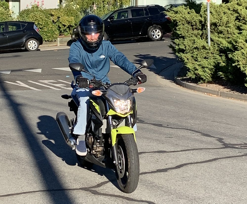author on a yellow Honda CB300F